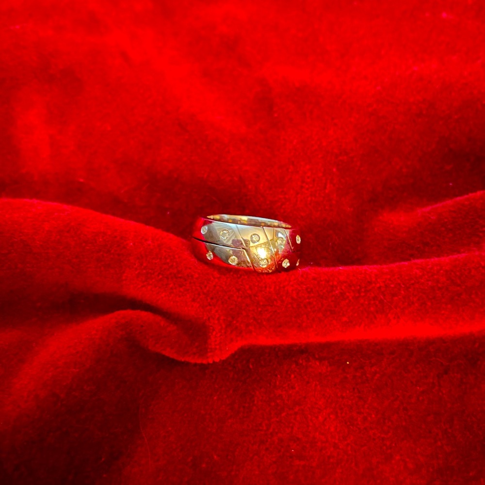 14k white gold gimmel type band with 12 diamonds with Appraisal papers.